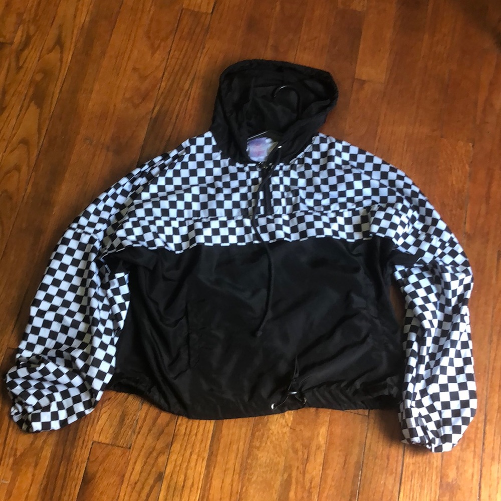 A checkered print windbreaker jacket kinda cropped